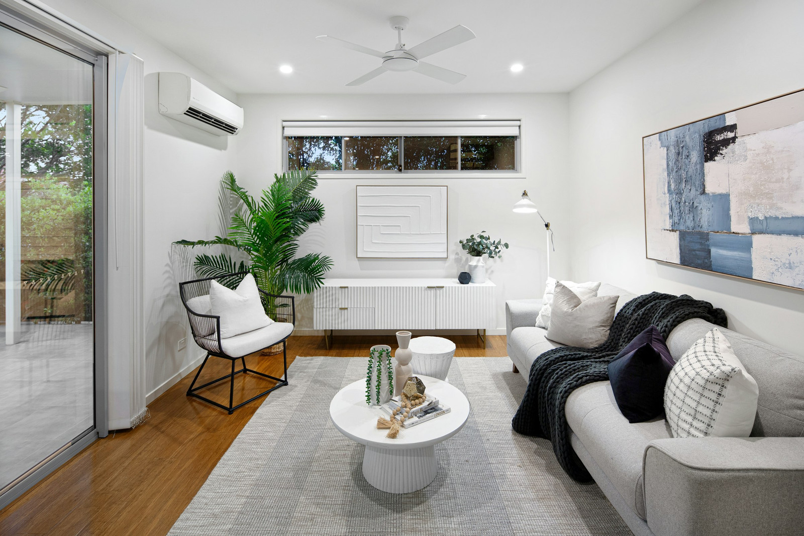 A bright living room cooled by a wall-mounted mini-split